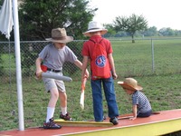 Tim and Karen Leard sons playing on backyard boat 